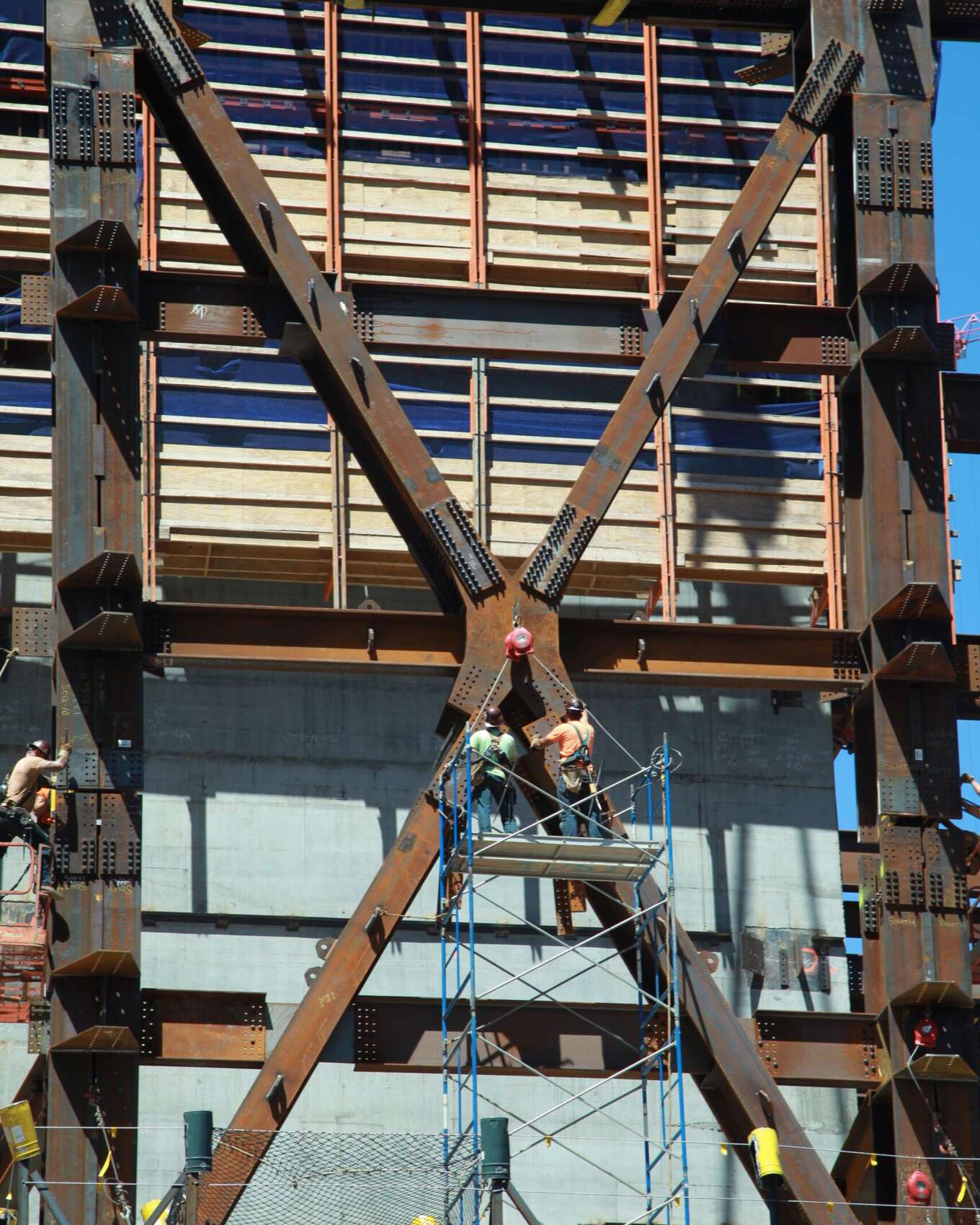 Workers tend to a CSD-designed connection at the 150 N Riverside project